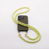 Mobile phone case with pearl necklace "SOLO" in SUNNY LIME